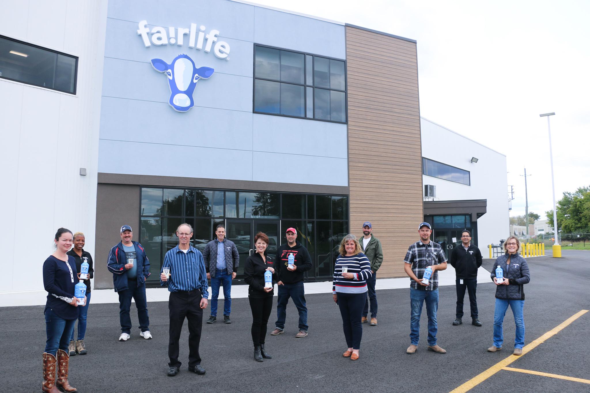 A group of local farmers standing in front of fairlife's new Canadian dairy facility in Peterborough, ON